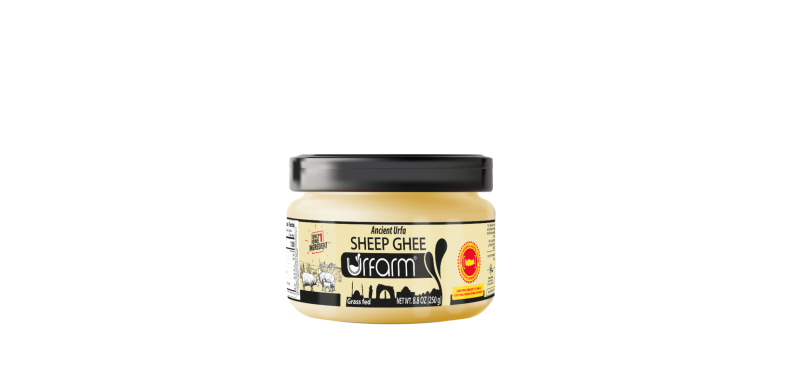 Sheep Ghee Jar of coconut oil with a black lid against a white background.